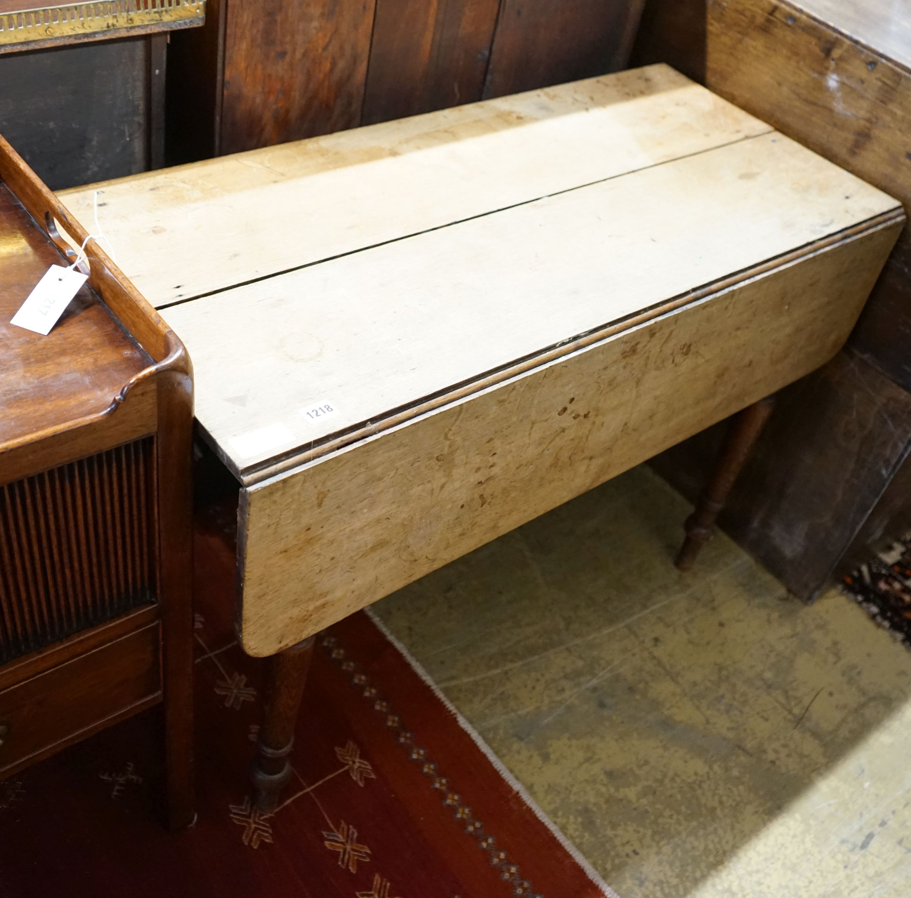 A red walnut clerk's desk and an oak Pembroke table